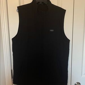 Travis Mathew’s Black Sleeveless Vest